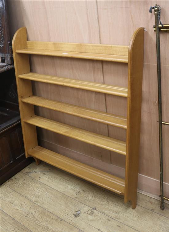 A hanging Arts & Crafts style oak plate rack, W.100cm